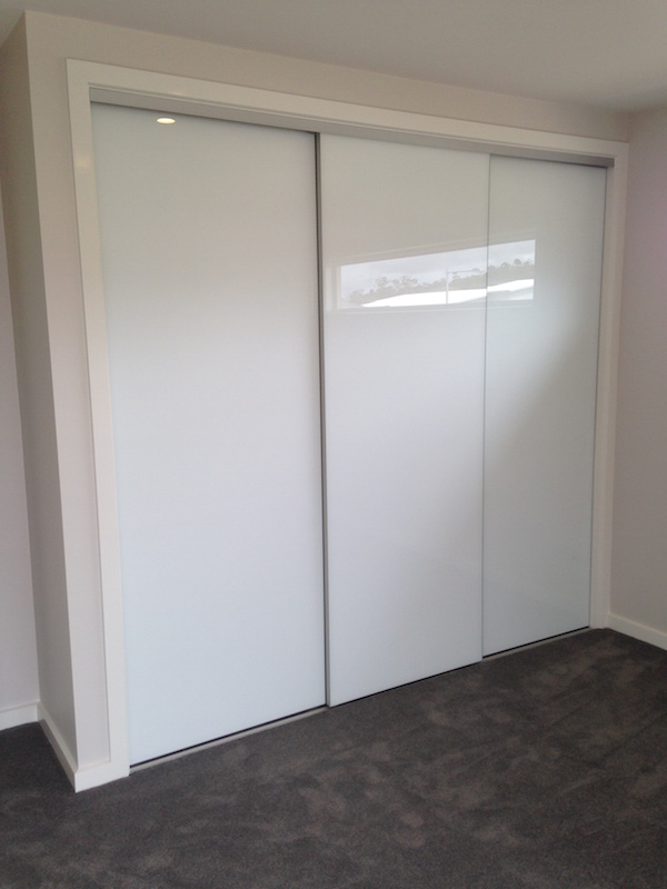 Pacific Wardrobes and Glass Frameless doors with white glass Pacific Wardrobes & Glass, Shower Screens, Mirrors, Wardrobes, Wardrobe Doors, Splashbacks
